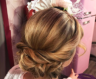 Bridal trends – Hair by Kelly – a loose bun twisted style