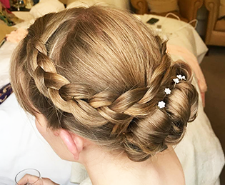 Bridal trends – Hair by Kelly – a plaited bun with white flowers