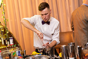 Man working bar at wedding to remember