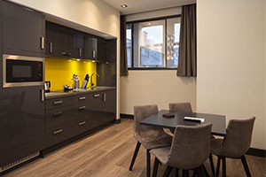 Roomzzzz aparthotels are ideal for a stag or hen party - lounge/kitchen area