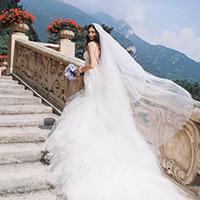Bride walking up stairs in wedding dress