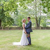 Married couple stood in the grounds Woodhall Spa