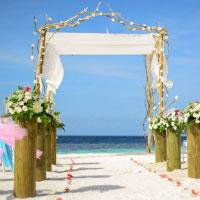 Wedding on beach next to the blue sea